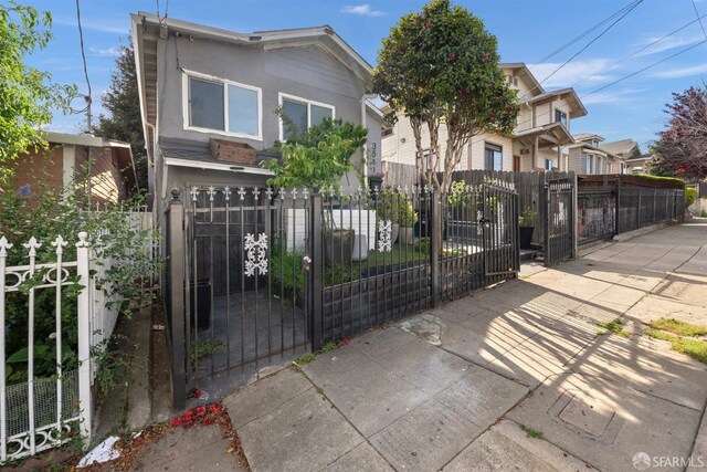 view of gate with a fenced front yard
