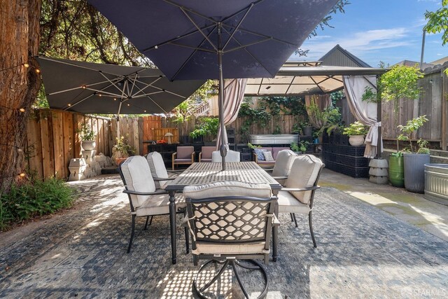 view of patio / terrace featuring outdoor dining area and a fenced backyard