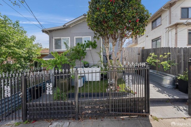 view of front of home featuring a gate and a fenced front yard