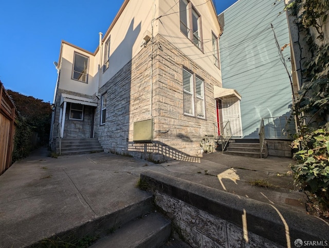 back of house with a patio area