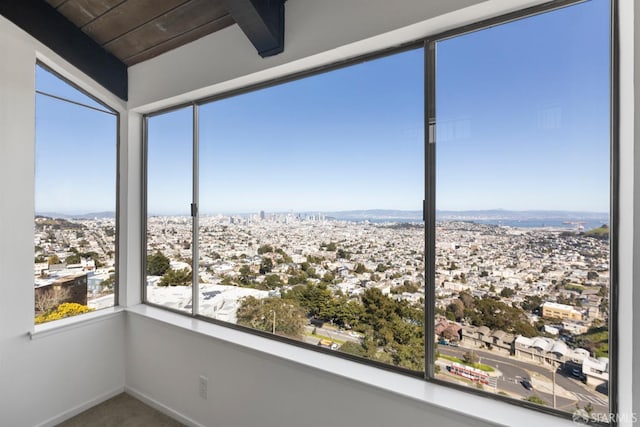 unfurnished sunroom featuring a city view