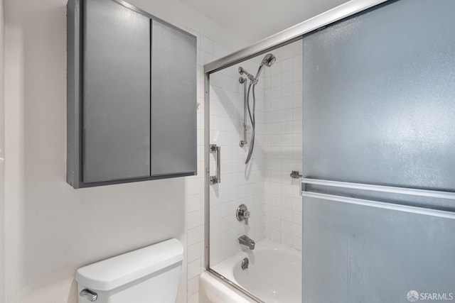 full bathroom featuring toilet and enclosed tub / shower combo