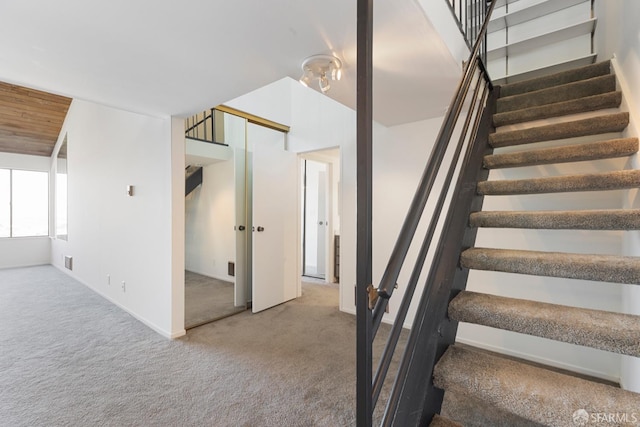 stairs with carpet and visible vents