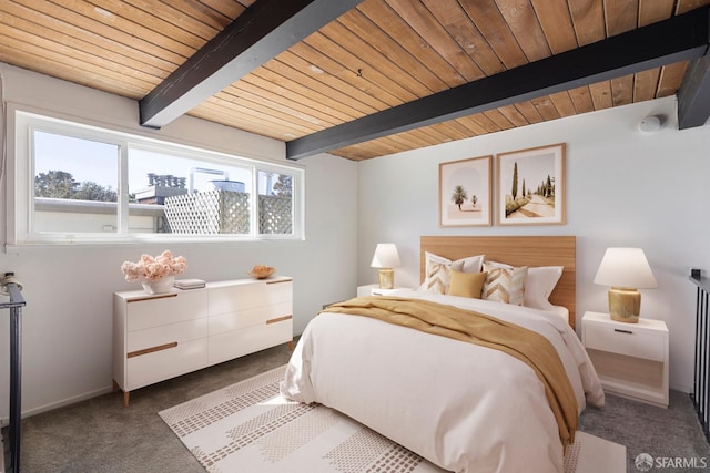 bedroom with wooden ceiling, carpet flooring, and beamed ceiling