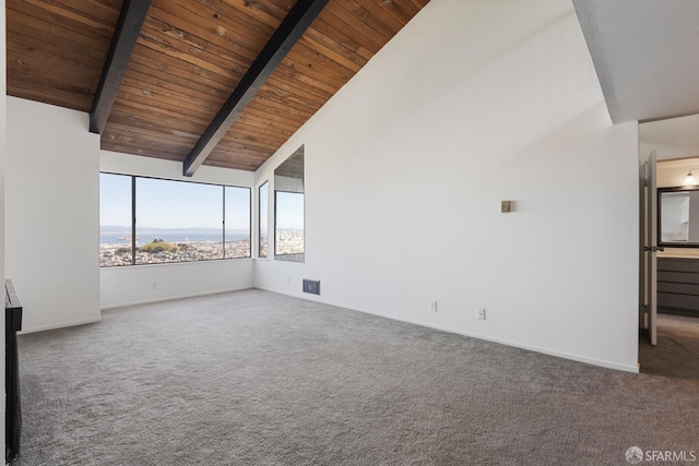 empty room featuring baseboards, wood ceiling, beamed ceiling, carpet flooring, and high vaulted ceiling