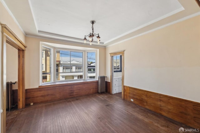 2440-2442 Balboa St, San Francisco, CA 94121 - unfurnished dining area featuring radiator heating unit, a tray ceiling, a chandelier, dark wood finished floors, and crown molding