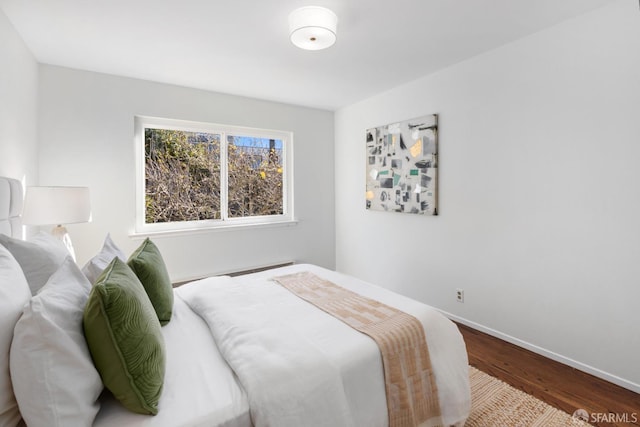 bedroom with hardwood / wood-style floors