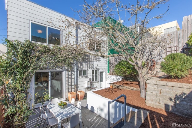 rear view of house featuring a patio