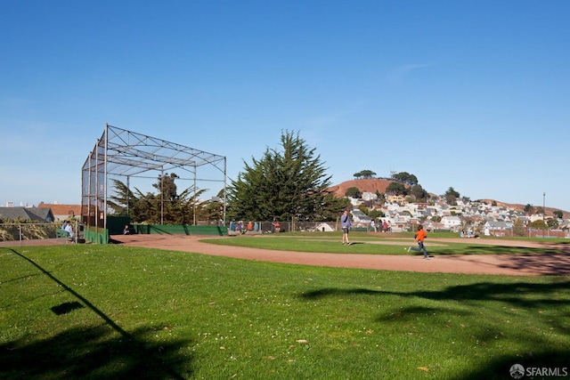 view of property's community with a yard