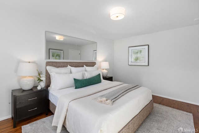 bedroom with wood-type flooring