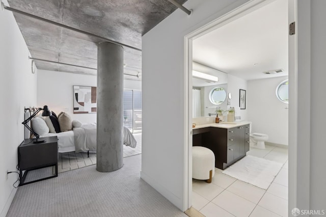 311 Oak St Unit 301, Oakland, CA 94607 - bedroom featuring connected bathroom and baseboards