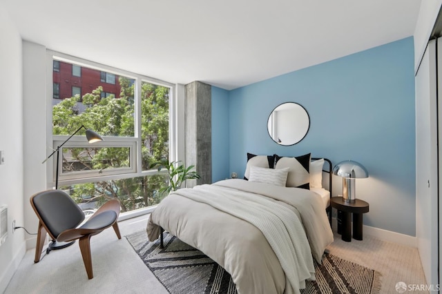 311 Oak St Unit 301, Oakland, CA 94607 - carpeted bedroom featuring baseboards and floor to ceiling windows