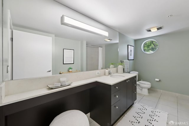 311 Oak St Unit 301, Oakland, CA 94607 - bathroom featuring toilet, double vanity, tile patterned floors, a shower with curtain, and baseboards