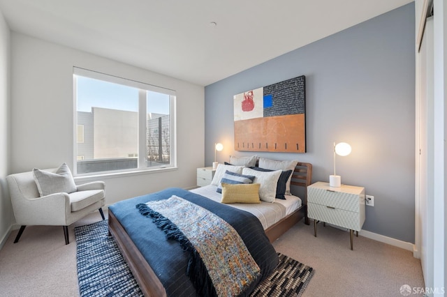 bedroom featuring light colored carpet