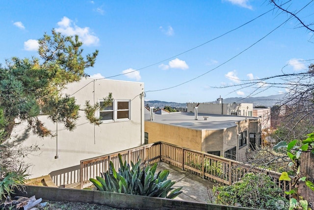 view of property exterior featuring a mountain view