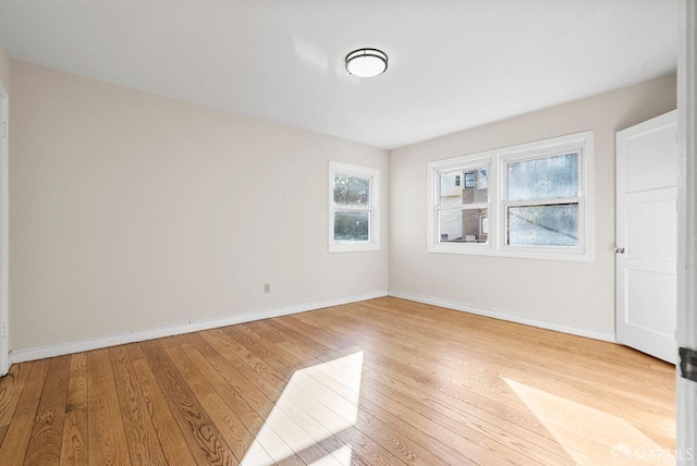 empty room with light hardwood / wood-style floors