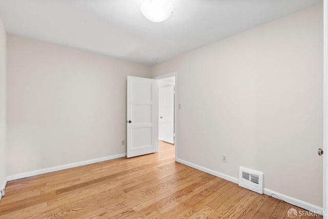 unfurnished room with light hardwood / wood-style flooring