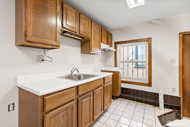 kitchen with light tile patterned floors and sink