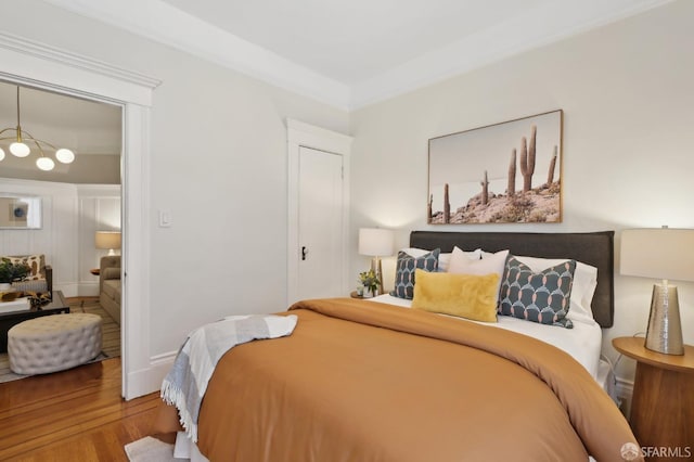 bedroom with wood finished floors