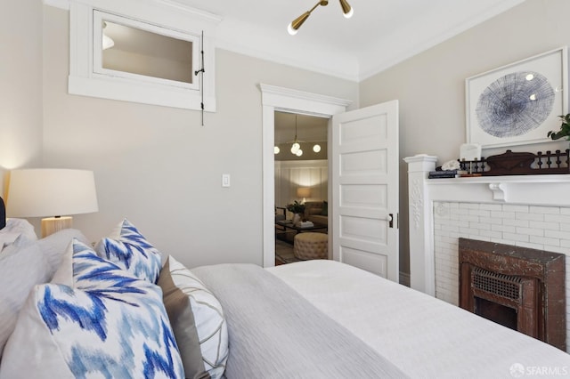 bedroom with a brick fireplace