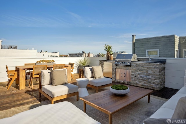 view of patio / terrace with a grill, an outdoor hangout area, outdoor dining area, and area for grilling