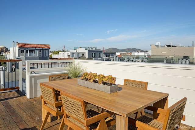 wooden deck featuring outdoor dining space