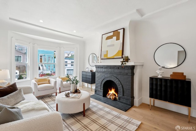 2066 Quesada Ave, San Francisco, CA 94124 - living room with a fireplace, light wood finished floors, and recessed lighting