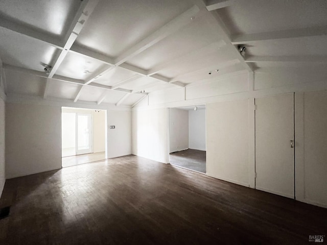 bonus room with hardwood / wood-style floors and lofted ceiling with beams