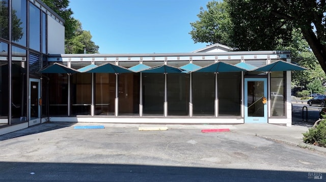 rear view of house with a sunroom