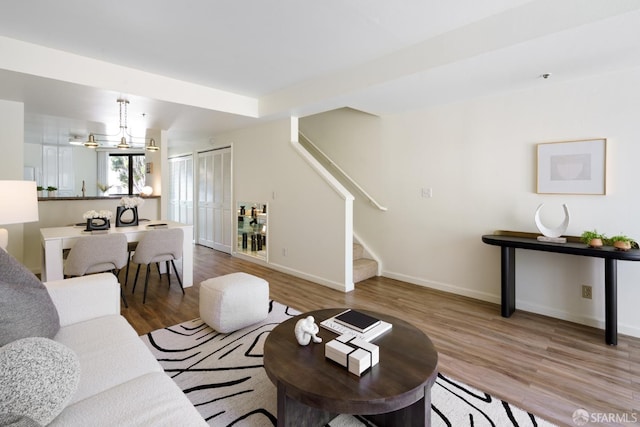 601 Van Ness Ave Unit 39, San Francisco, CA 94102 - living area featuring baseboards, stairs, and wood finished floors