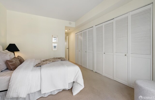 601 Van Ness Ave Unit 39, San Francisco, CA 94102 - bedroom with multiple closets, light carpet, and recessed lighting