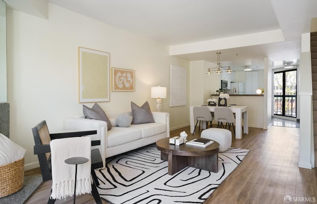 601 Van Ness Ave Unit 39, San Francisco, CA 94102 - living area featuring baseboards and wood finished floors