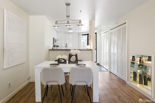 601 Van Ness Ave Unit 39, San Francisco, CA 94102 - dining room featuring baseboards and dark wood-type flooring