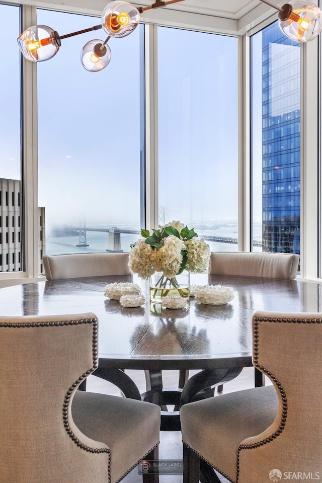 301 Mission St Unit 40D, San Francisco, CA 94105 - dining room with expansive windows, a water view, and a chandelier