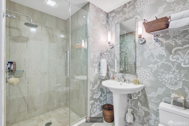 301 Mission St Unit 40D, San Francisco, CA 94105 - bathroom featuring a stall shower, toilet, and wallpapered walls