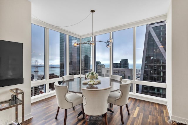 301 Mission St Unit 40D, San Francisco, CA 94105 - dining room featuring a city view, wood finished floors, a wall of windows, a water view, and a chandelier