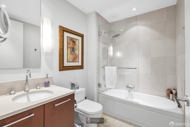 301 Mission St Unit 40D, San Francisco, CA 94105 - full bath featuring vanity, toilet, combined bath / shower with glass door, recessed lighting, and tile patterned flooring