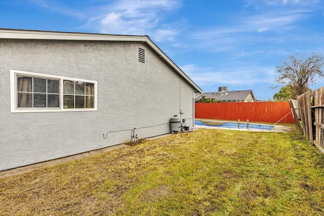 view of yard with a fenced in pool and a fenced backyard