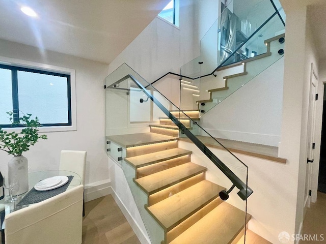 stairway featuring hardwood / wood-style floors