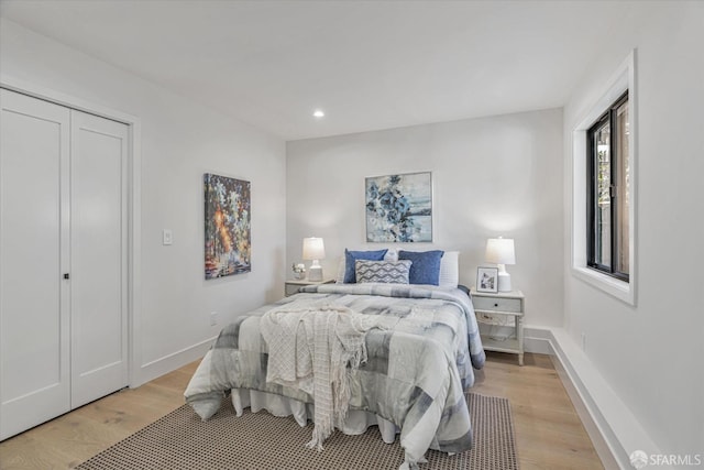 bedroom with light wood-type flooring