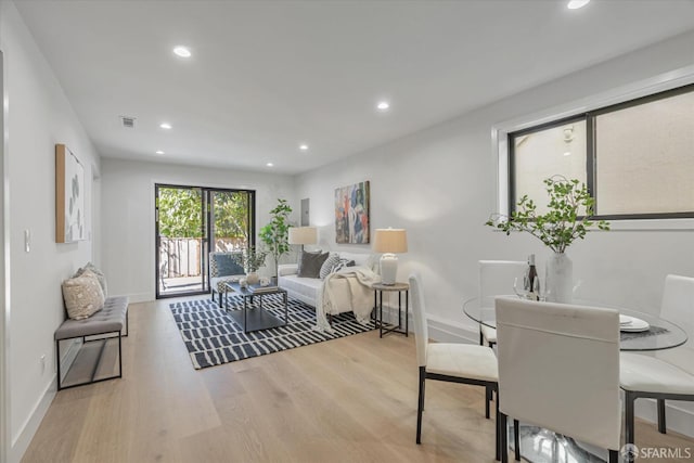 living room with light hardwood / wood-style flooring