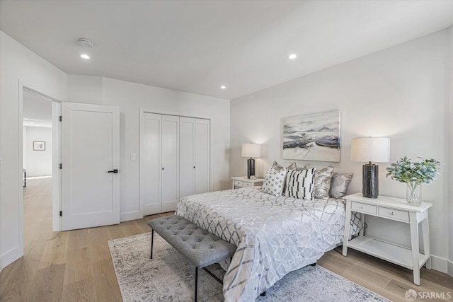 bedroom featuring light hardwood / wood-style flooring and a closet