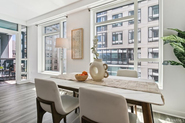 1688 Pine St Unit E709, San Francisco, CA 94109 - dining area with plenty of natural light, wood finished floors, and baseboards