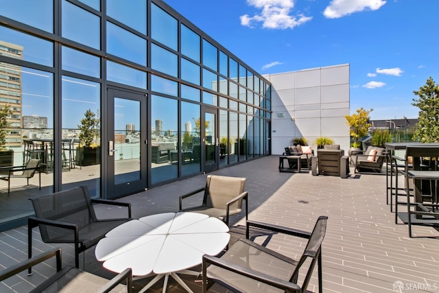 1688 Pine St Unit E709, San Francisco, CA 94109 - view of patio / terrace featuring an outdoor living space, a view of city, and a wooden deck