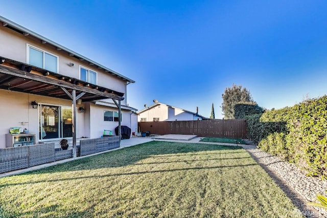 view of yard featuring a fenced backyard and a patio