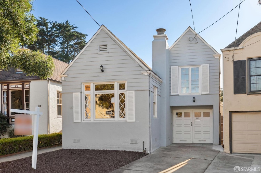 bungalow featuring a garage