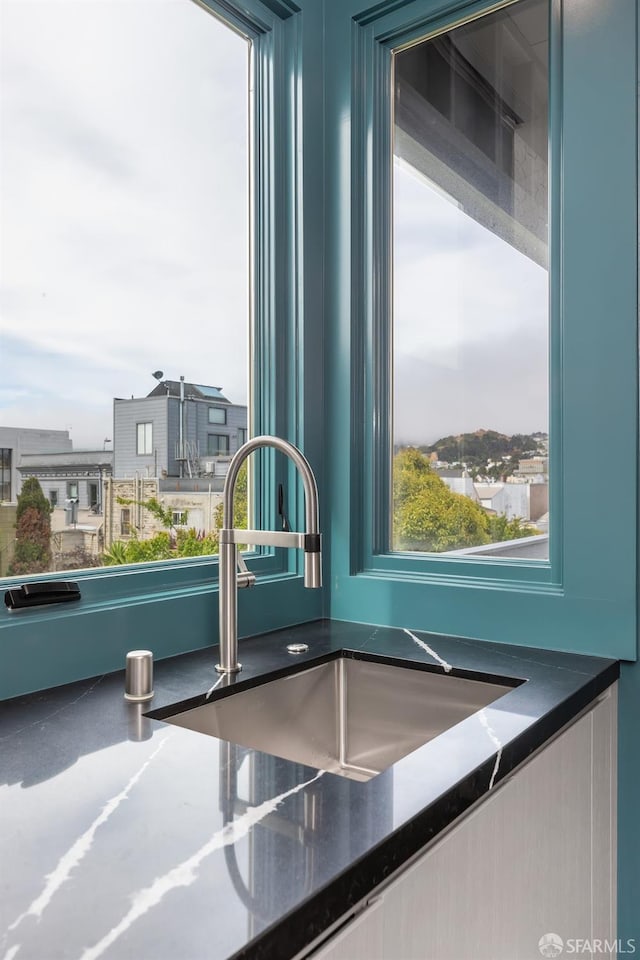 kitchen with blue cabinets and sink