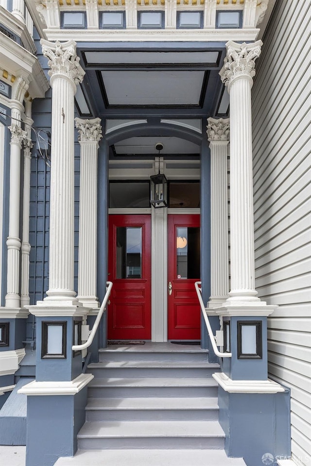 view of exterior entry featuring french doors