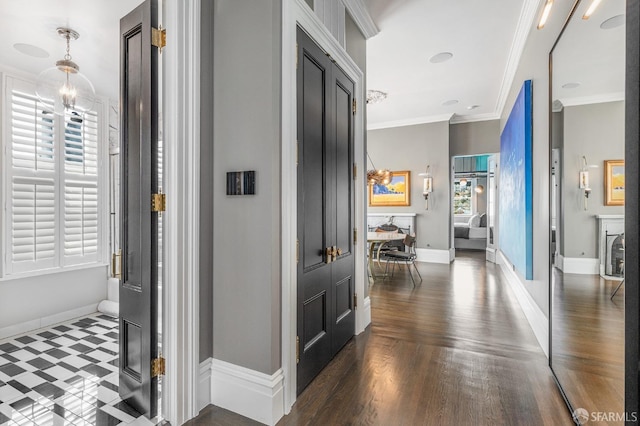 hall featuring crown molding and dark wood-type flooring