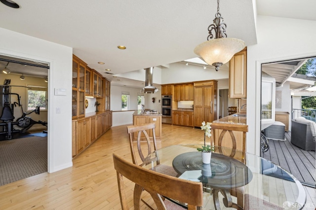 12553 Parker Ranch Ct, Saratoga, CA 95070 - dining area with light wood-type flooring, vaulted ceiling, and recessed lighting